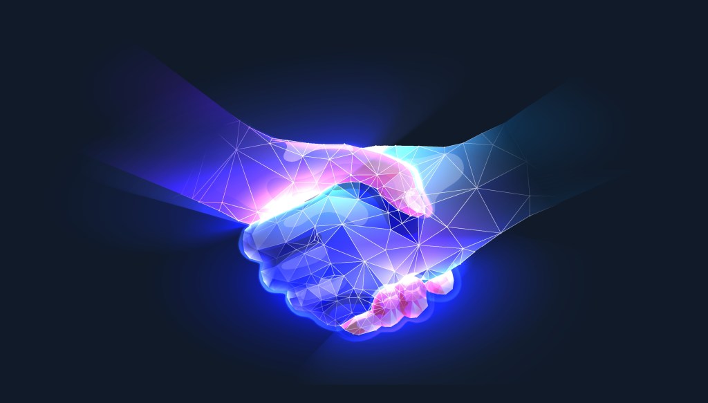 Handshake in digital futuristic style.  The concept of partnership, collaboration or teamwork.  Vector illustration with light effect and neon