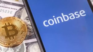 Coinbase logo (COIN stock) on a smartphone screen with a BTC token. Crypto winter is coming.