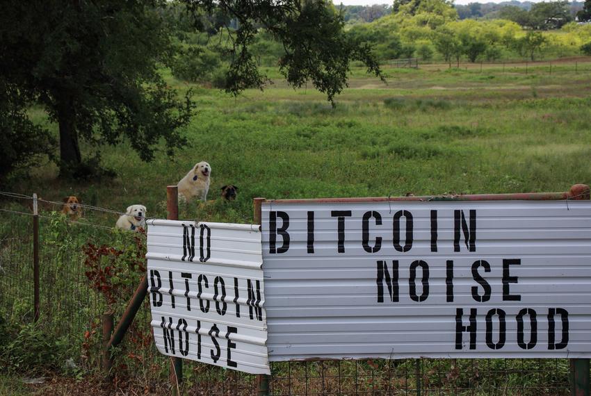 Signs are displayed on the fence of Cheryl Shadden’s property in Granbury, Texas, on June 11, 2024.